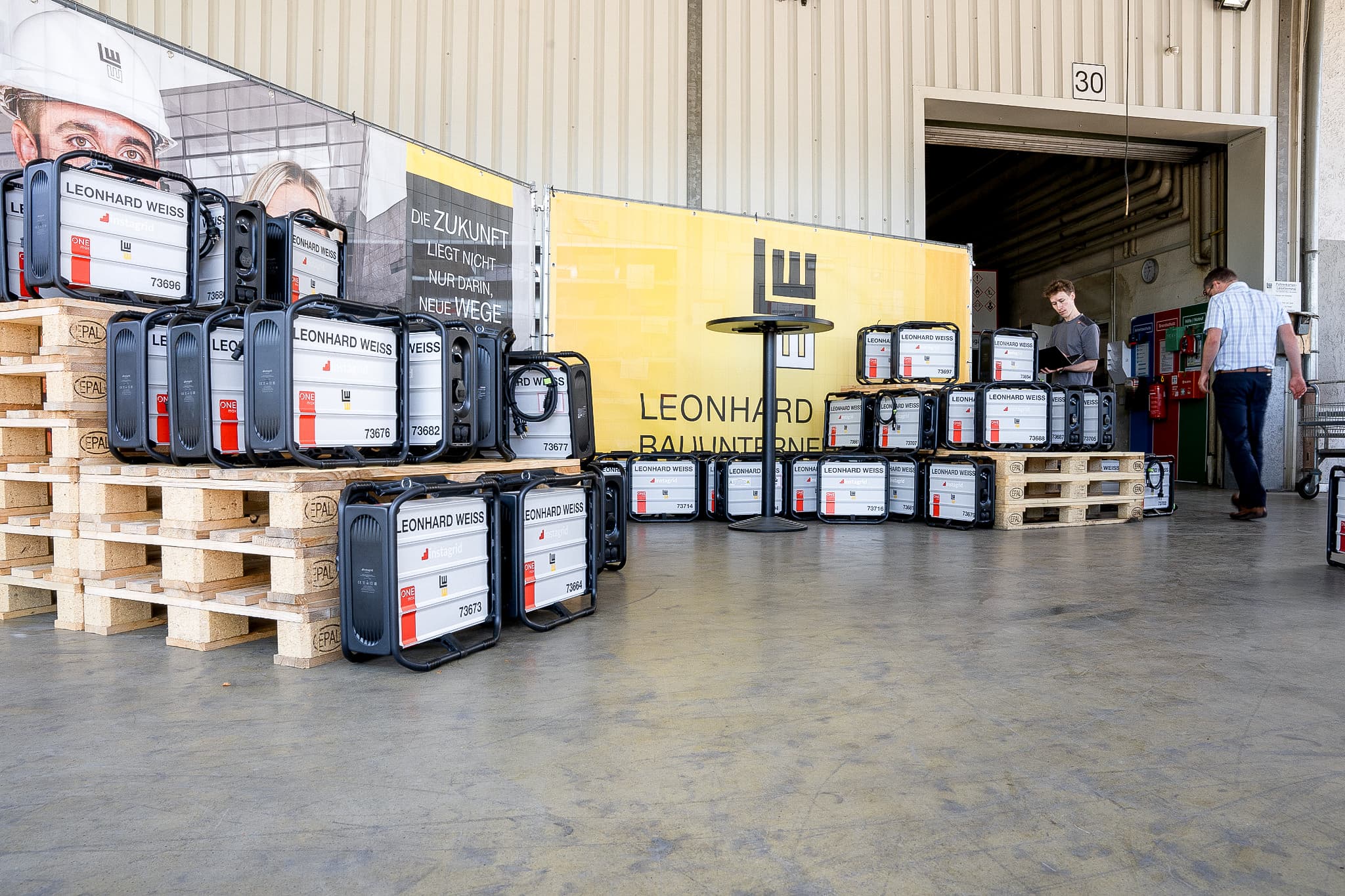 LEONHARD WEISS partnership with Instagrid, devices displayed on wooden pallets